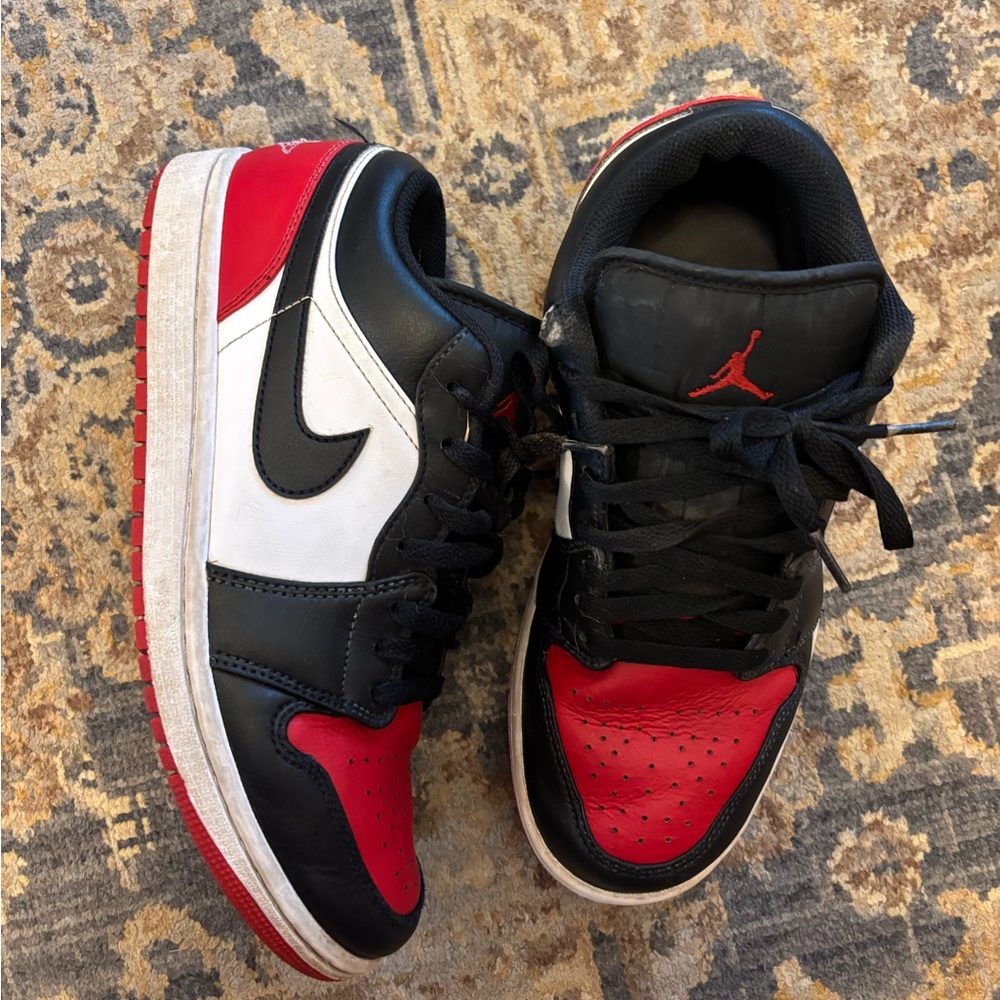 Nike Air Jordan 1 low Black red and white Athletic Shoes